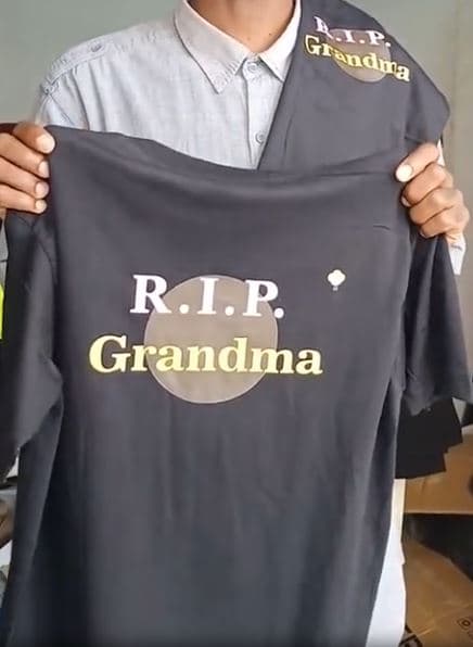 Custom black memorial t-shirts with R.I.P. Grandma gold lettering printed in Nairobi